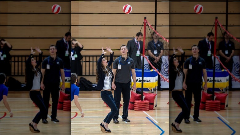 Kate Middleton playing volleyball in gymnasium