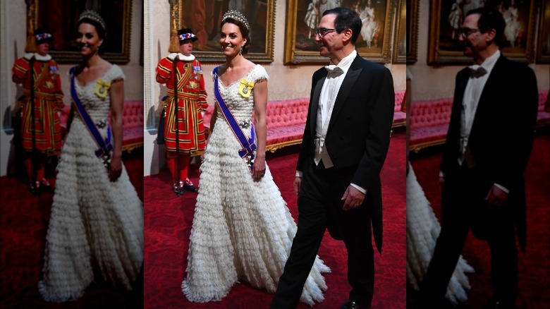 Kate Middleton wearing white gown, tiara