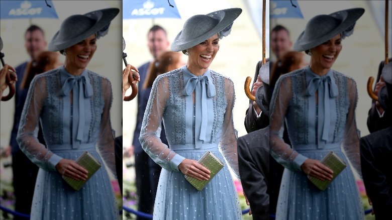 Kate Middleton laughing in blue dress