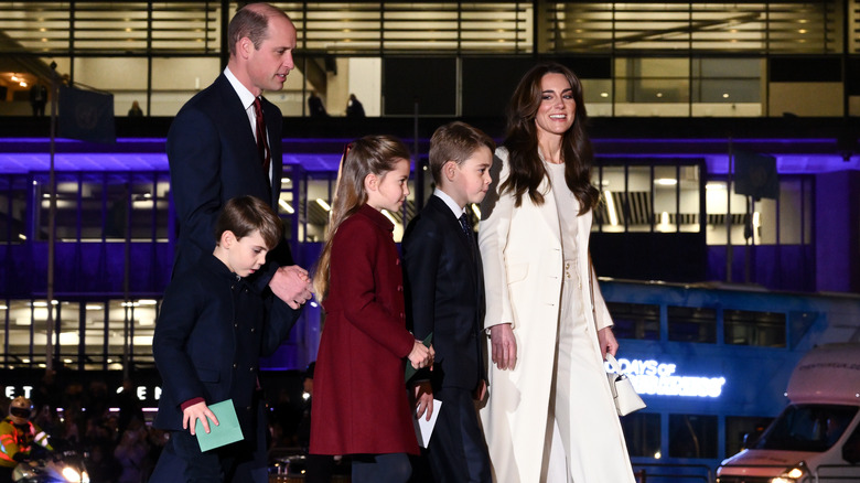 Prince William and Kate Middleton out at night with their children