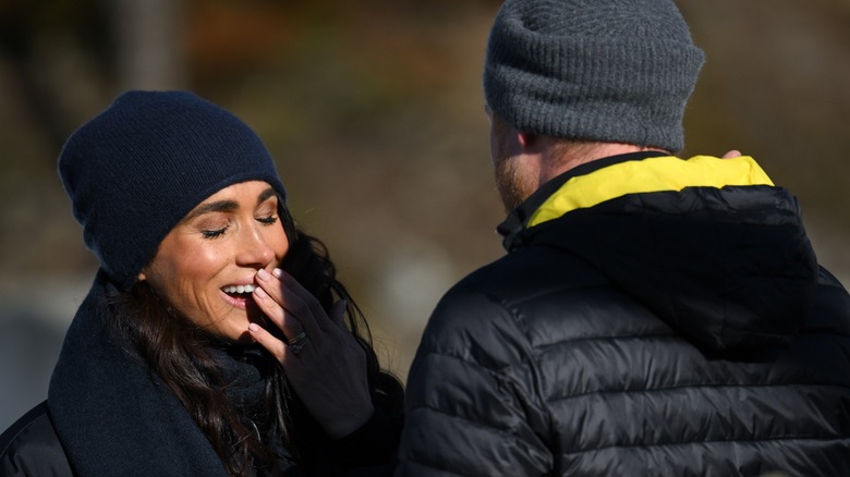 Meghan Markle laughing with Prince Harry