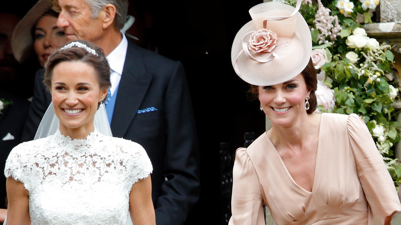 Pippa and Kate Middleton smiling