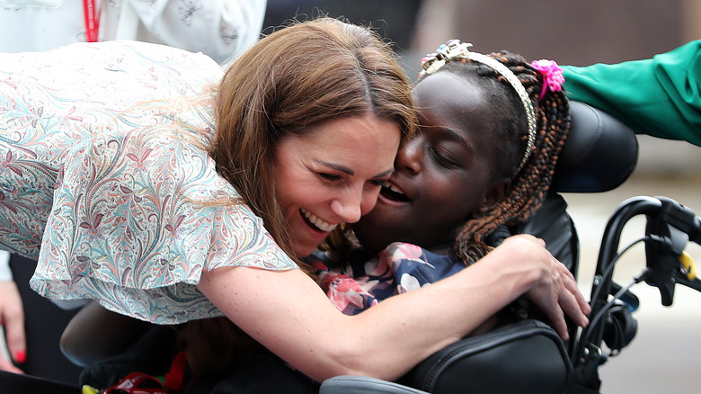 Catherine, Princess of Wales hugging a fan