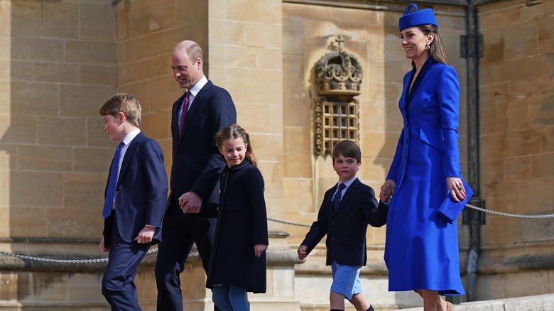 The Wales family walking to church