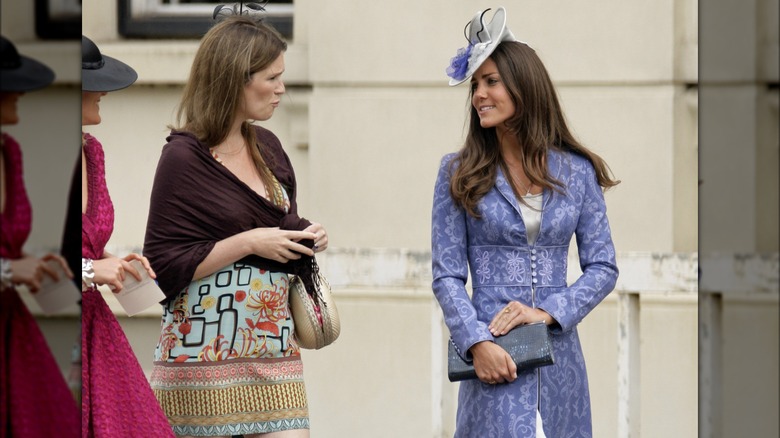 Kate Middleton walking and talking with an unidentified person