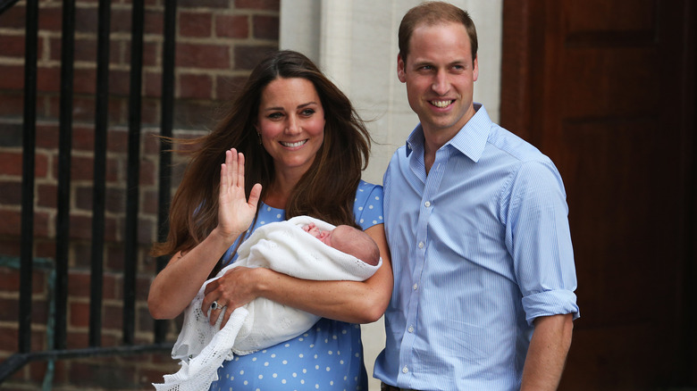 Princess Catherine holding Prince George 