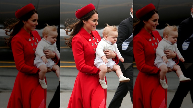 Princess Catherine holding Prince George 