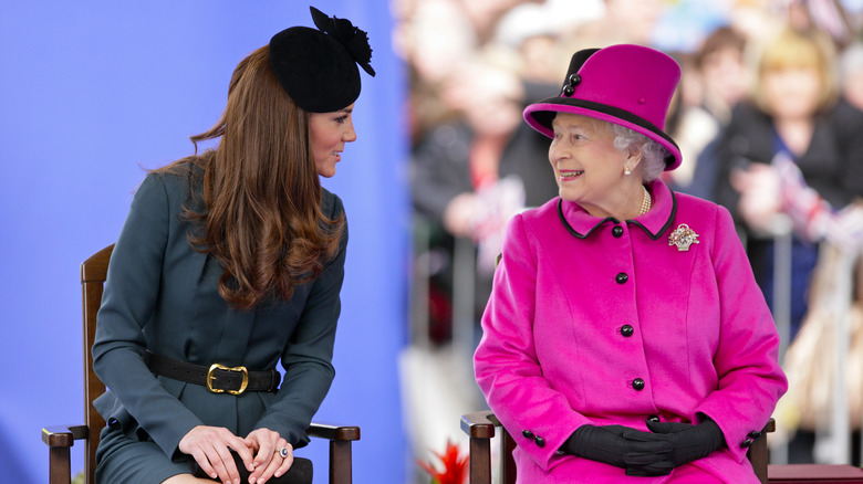 Queen Elizabeth smiling at Kate Middleton