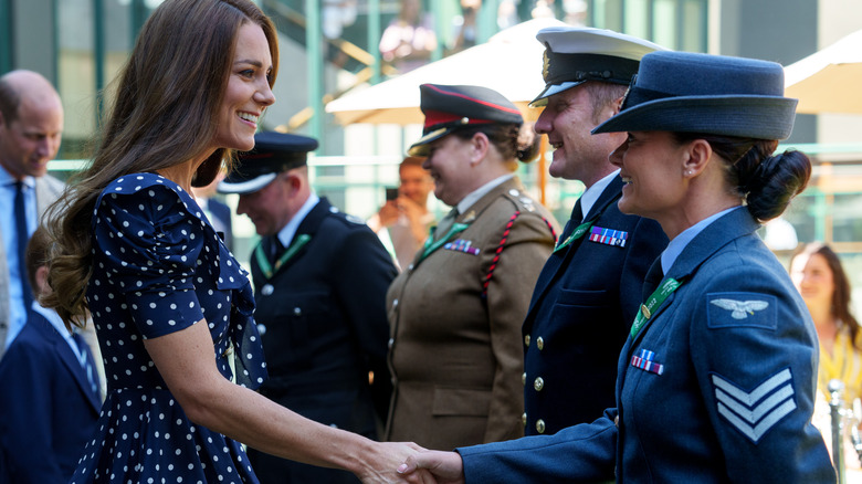 Princess Catherine shaking hands with officials