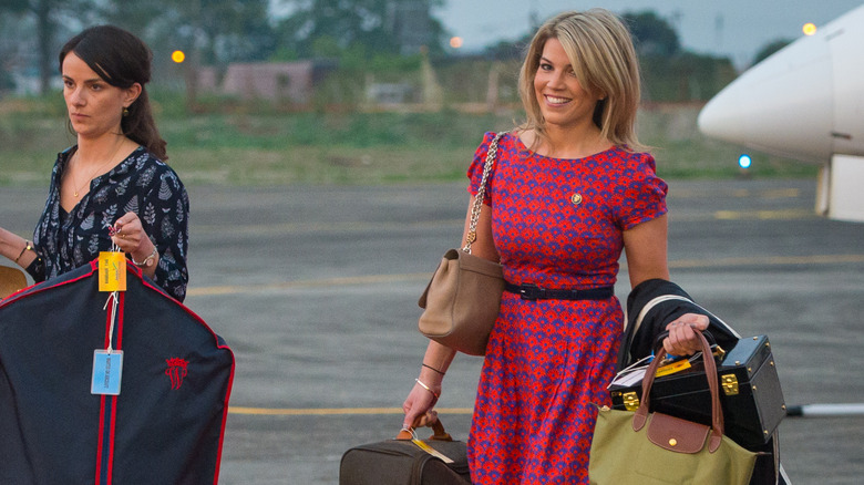 Stylist Natasha Archer carrying Princess Catherine's bags