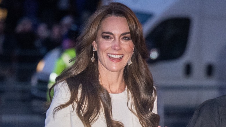 Kate Middleton smiling and walking