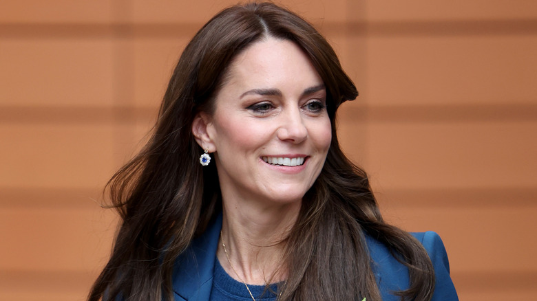 Kate Middleton smiling in dark blue