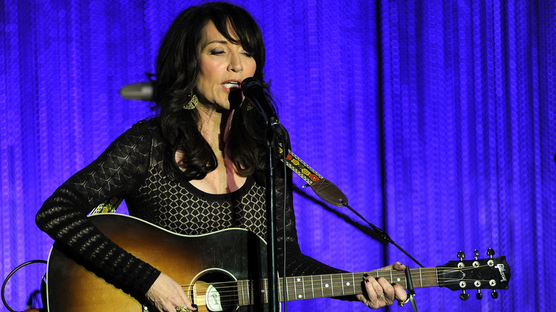 Katey Sagal singing and playing guitar