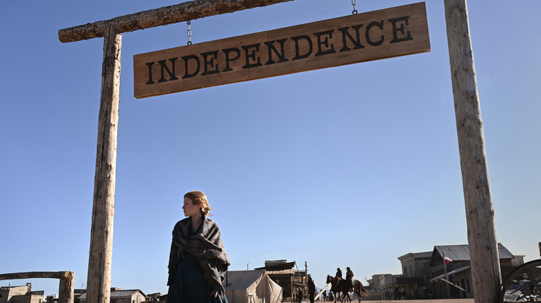 Abby under Independence sign in Walker Independence