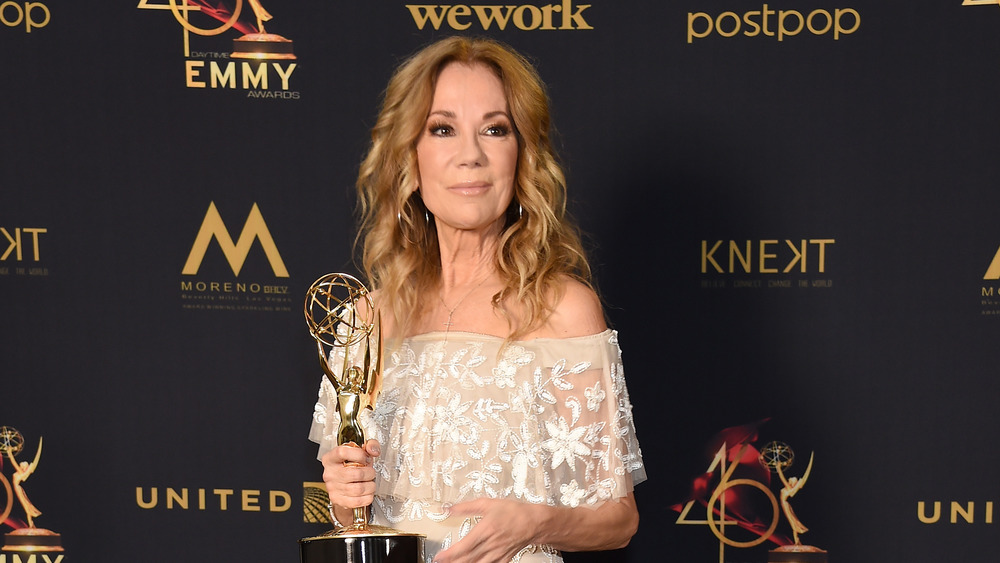 Kathie Lee Gifford holding an Emmy