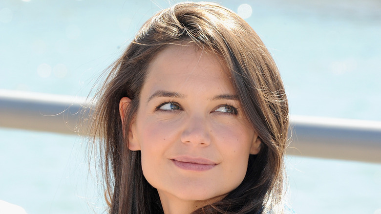 Katie Holmes looking off to one side at a party