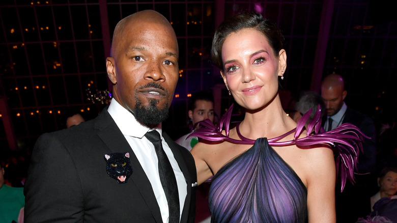 Jamie Foxx and Katie Holmes standing together