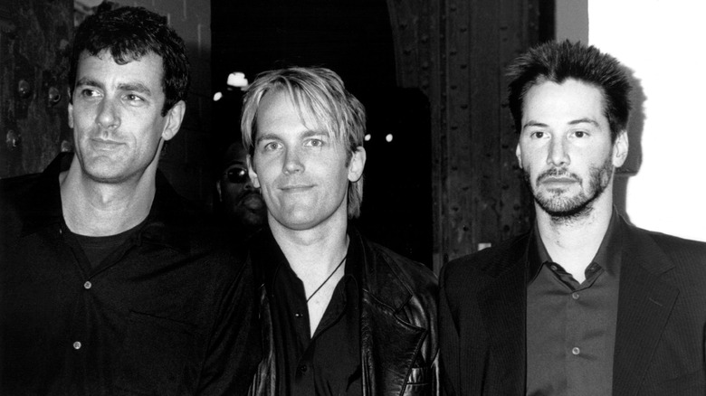 Keanu Reeves with band members