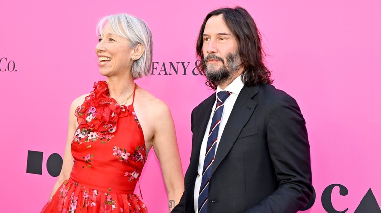 Keanu Reeves and Alexandra Grant at a public event