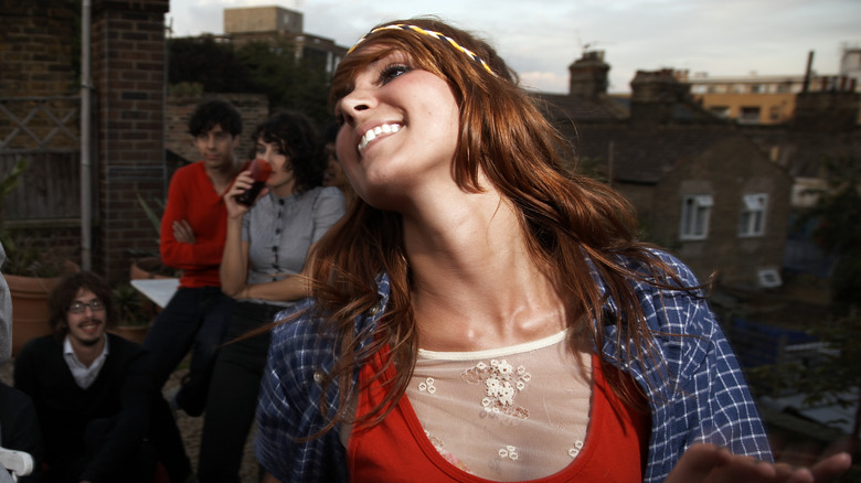 Woman with ginger colored hair dancing