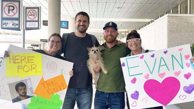 (L-R) Leslie Davis, Evan Thomas, Keith Bynum, and Lyndsay Lamb standing with signs