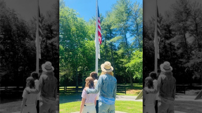 Nicole Kidman and daughters viewing flag