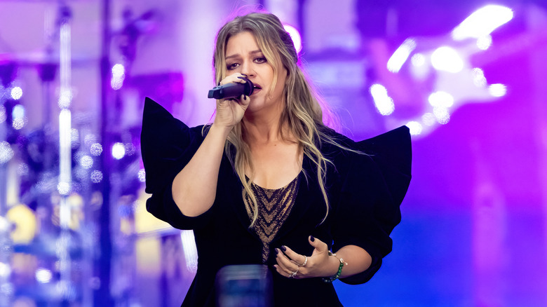 Kelly Clarkson performing on stage