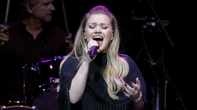 Kelly Clarkson performing on stage