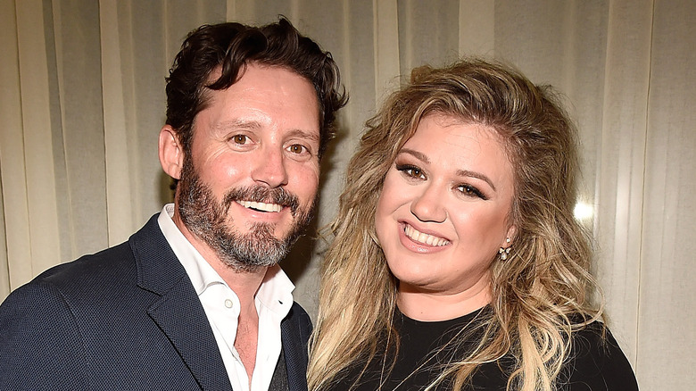 Kelly Clarkson and Brandon Blackstock at an event.