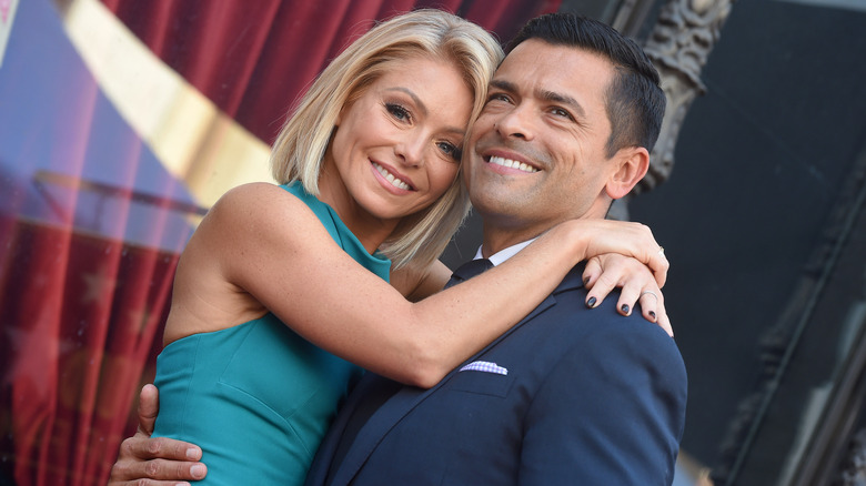 Kelly Ripa and Mark Consuelos cuddling up