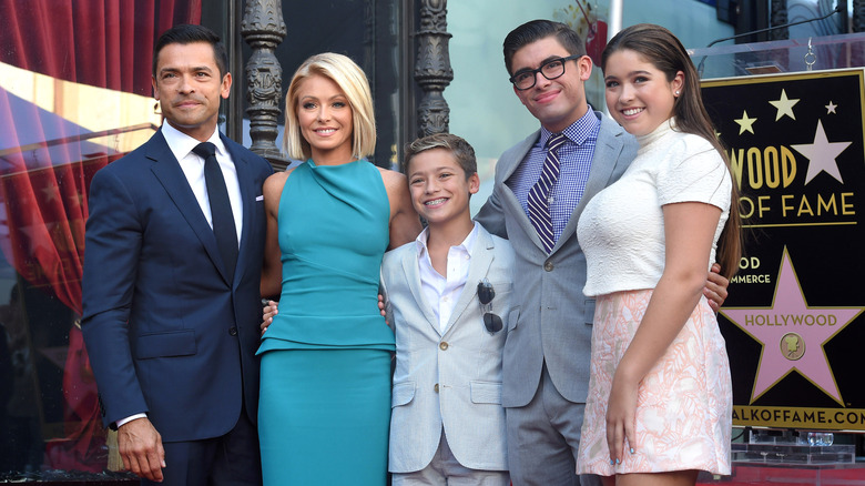 Mark Consuelos and Kelly Ripa with their three kids