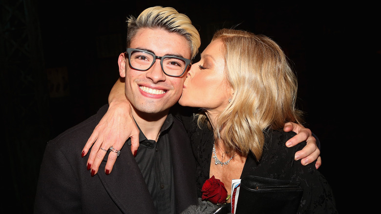 Kelly Ripa kissing Michael Consuelos