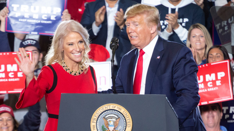 Kellyanne Conway and Donald Trump appear onstage together