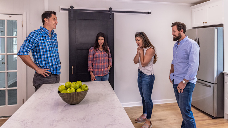 Ken and Anita Corsini showing kitchen