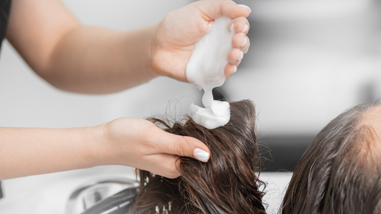 woman getting her hair washed