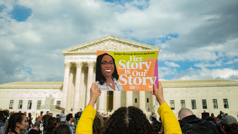 Advocate holds sign celebrating Justice Jackson