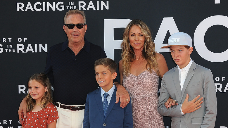 Kevin Costner and Christine Baumgartner with their three kids