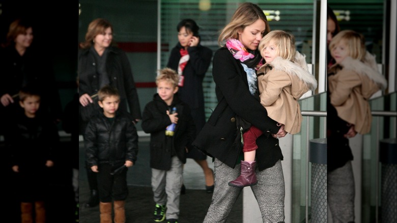 Christine Baumgartner at airport with kids