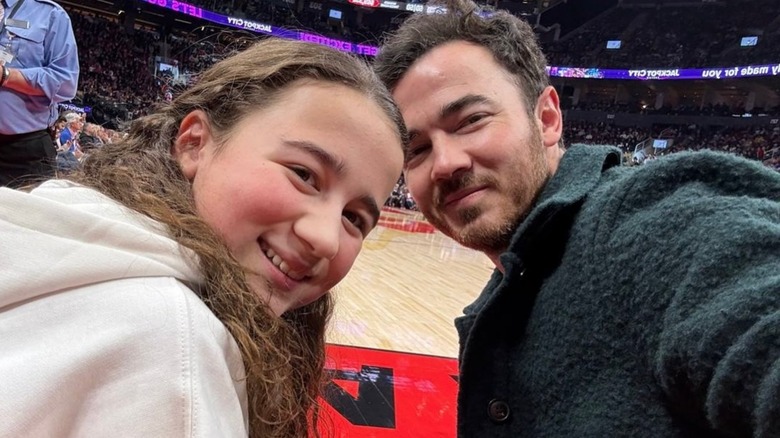 Alena Jonas and Kevin Jonas at a basketball game