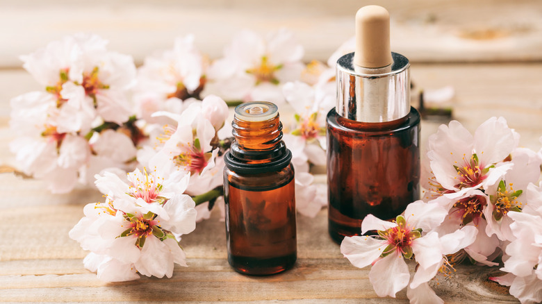 Bath oils surrounded by flowers 