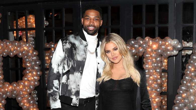 Khloe Kardashian and Tristan Thompson at an event 