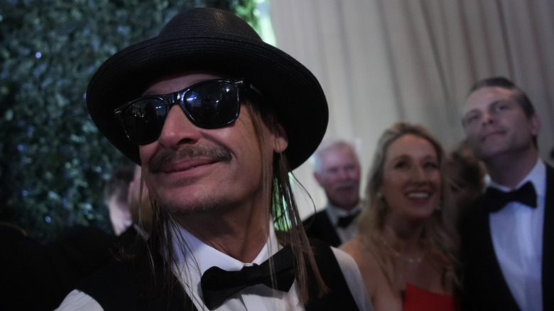 Kid Rock smiling at a political event