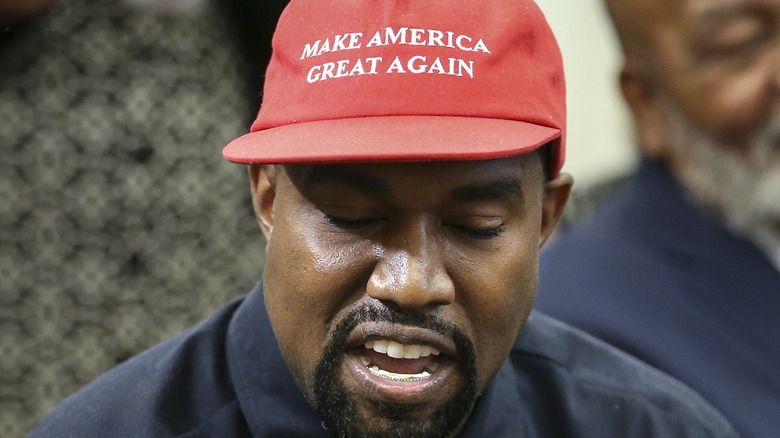 Kanye West in MAGA cap