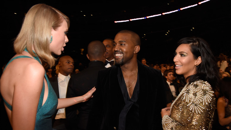 Taylor Swift talking to Kanye West and Kim Kardashian