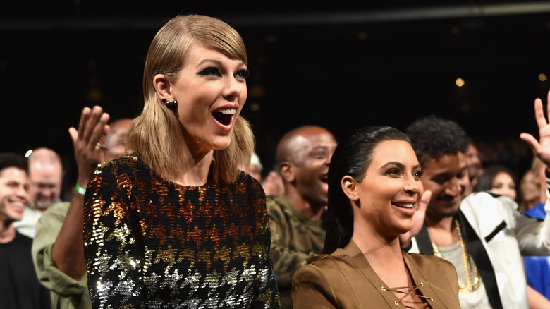 Taylor Swift and Kim Kardashian smiling