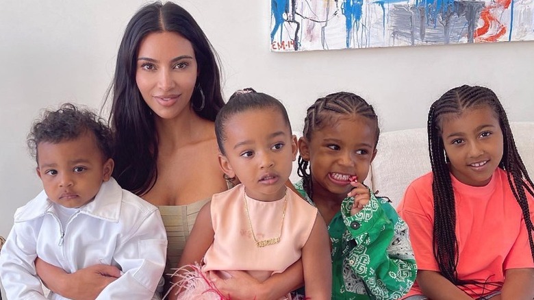 Kim Kardashian smiling with her kids