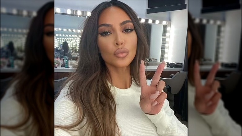 Kim Kardashian giving peace sign