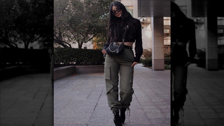 Woman wearing black turtleneck and sock boots