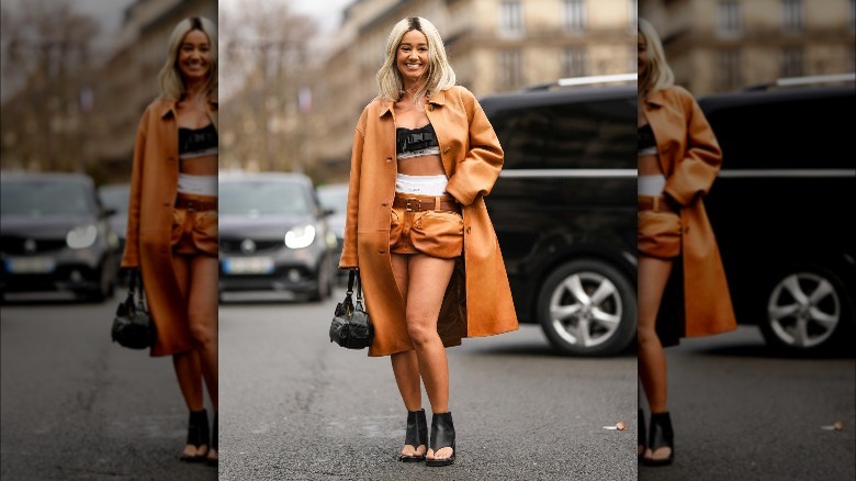 Woman in an orange cargo skirt