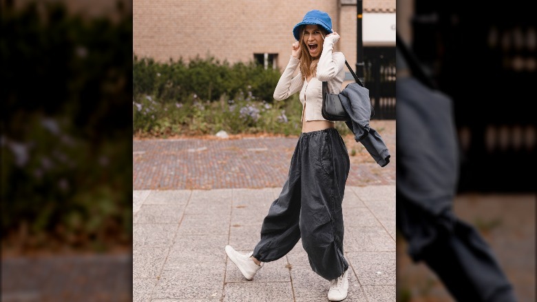 Smiling woman with blue bucket hat